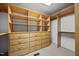Well-organized walk-in closet with custom shelving, drawers, and ample storage space at 1973 Elon Ossipee Rd, Elon, NC 27244