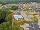 Aerial view showcases the community pool, playground, and surrounding neighborhood amenities at 2009 Latham Oaks Ave, Wake Forest, NC 27587