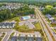 Aerial view featuring a community pool, playground, and well-planned neighborhood layout at 2009 Latham Oaks Ave, Wake Forest, NC 27587