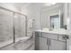 Modern bathroom with a glass-enclosed shower, marble floors, and a sleek vanity at 2009 Latham Oaks Ave, Wake Forest, NC 27587