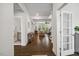 Welcoming foyer with hardwood floors, leading to the living room and a glimpse of the bathroom at 2009 Latham Oaks Ave, Wake Forest, NC 27587