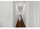 Hallway featuring hardwood floors and neutral paint colors at 2009 Latham Oaks Ave, Wake Forest, NC 27587