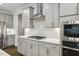 Stylish kitchen with white countertops, stainless steel appliances, and modern backsplash at 2009 Latham Oaks Ave, Wake Forest, NC 27587