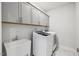 Laundry room featuring front loading washer/dryer and utility sink at 2009 Latham Oaks Ave, Wake Forest, NC 27587