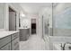 Main bathroom features double vanity, glass enclosed shower, and soaking tub at 2009 Latham Oaks Ave, Wake Forest, NC 27587