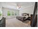 Spacious main bedroom features a trey ceiling, large windows, and a ceiling fan at 2009 Latham Oaks Ave, Wake Forest, NC 27587