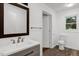 Bathroom with a modern vanity and hardwood style flooring at 2085 Enon Rd, Oxford, NC 27565