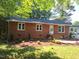 Charming brick home featuring a landscaped yard, enhancing its curb appeal at 2085 Enon Rd, Oxford, NC 27565