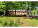 Charming brick ranch-style home with a well-manicured lawn and mature trees at 2085 Enon Rd, Oxford, NC 27565