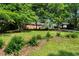 Charming brick ranch-style home with a well-manicured lawn and mature trees at 2085 Enon Rd, Oxford, NC 27565
