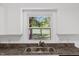 Close up of the kitchen sink with view of the large backyard at 2085 Enon Rd, Oxford, NC 27565
