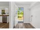 Laundry room with a doorway to the back yard and stainless steel dishwasher at 2085 Enon Rd, Oxford, NC 27565