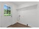 Bright laundry room with backyard view and storage shelf at 2085 Enon Rd, Oxford, NC 27565