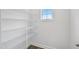 Spacious walk-in closet with multiple wire shelves, offering plenty of storage space at 219 Broomgrove Way, Wake Forest, NC 27587