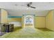 Unique living room with vintage ceiling fan and a windowed nook with bright natural light at 219 W Parker St, Graham, NC 27253