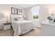 This bedroom features a comfortable bed, a window and decorations for a welcoming and peaceful ambiance at 220 Rosewood Dr, Sanford, NC 27330