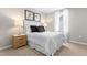 This bedroom showcases a well-lit space, stylish decor and a comfortable bed with matching nightstands at 220 Rosewood Dr, Sanford, NC 27330