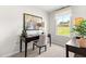 Cozy office space featuring a dark desk, comfortable chair, and ample natural light from a window at 220 Rosewood Dr, Sanford, NC 27330