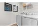 The laundry room features modern appliances, shelving and a clean functional space at 220 Rosewood Dr, Sanford, NC 27330