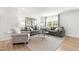 Comfortable living room with two sofas, a patterned rug, and natural light from the window at 220 Rosewood Dr, Sanford, NC 27330