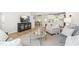 Inviting living space featuring a sofa, accent chair, kitchen view, and wood-look flooring at 220 Rosewood Dr, Sanford, NC 27330