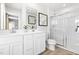 Modern main bathroom featuring a double sink vanity and a glass-enclosed shower at 220 Rosewood Dr, Sanford, NC 27330