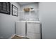 Laundry room featuring a washer, dryer and shelving for storage at 221 Rosewood Dr, Sanford, NC 27330
