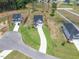 Aerial shot of a newly constructed neighborhood with well-manicured lawns and contemporary homes at 224 Wild Turkey Way, Lillington, NC 27546