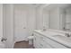 Bathroom features double sinks, white cabinetry and a full shower with a tiled floor at 224 Wild Turkey Way, Lillington, NC 27546