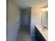 Bathroom featuring a walk-in shower, double sinks, and quartz countertops at 224 Wild Turkey Way, Lillington, NC 27546