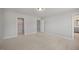 Bedroom featuring carpeted floor, two doorways, and a walk-in closet at 224 Wild Turkey Way, Lillington, NC 27546