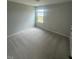 Bedroom with a neutral carpet, natural light from a window, and white trim at 224 Wild Turkey Way, Lillington, NC 27546
