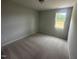 Neutral bedroom features soft carpet, natural light, and neutral paint at 224 Wild Turkey Way, Lillington, NC 27546