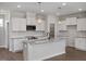 Modern kitchen showcasing white cabinets, granite countertops, stainless steel appliances and pendant lighting at 224 Wild Turkey Way, Lillington, NC 27546