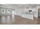 Open concept living area showcasing kitchen with granite island and stainless steel appliances and dining area at 224 Wild Turkey Way, Lillington, NC 27546