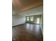 Bright open-concept living area features neutral paint and wood-look flooring at 224 Wild Turkey Way, Lillington, NC 27546