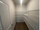 Walk-in pantry with metal shelving provides ample storage space at 224 Wild Turkey Way, Lillington, NC 27546