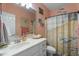 Charming bathroom with beach themed decor, a shower-tub and ample counter space at 229 Hocutt Farm Dr Dr, Clayton, NC 27527
