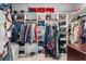 Organized walk-in closet with shelves and hanging racks for clothing and shoes at 229 Hocutt Farm Dr Dr, Clayton, NC 27527