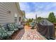 A wooden deck is furnished with floral chairs, a rug, and a grill perfect for outdoor entertaining at 229 Hocutt Farm Dr Dr, Clayton, NC 27527