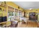 Dining area with ample natural light, dining table, and charming decor at 229 Hocutt Farm Dr Dr, Clayton, NC 27527