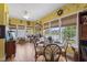Dining room with large windows and decoratively arranged table at 229 Hocutt Farm Dr Dr, Clayton, NC 27527