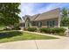 Beautiful brick home featuring green shutters and a well-maintained lawn with a sidewalk at 229 Hocutt Farm Dr Dr, Clayton, NC 27527