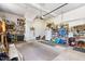 Spacious two-car garage with ample storage and workspace, featuring a carpeted area at 229 Hocutt Farm Dr Dr, Clayton, NC 27527