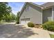 Spacious two-car garage with a long driveway and well-maintained landscaping at 229 Hocutt Farm Dr Dr, Clayton, NC 27527