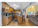 Spacious kitchen with wood cabinetry, stainless steel appliances, and seamless flow to the living area at 229 Hocutt Farm Dr Dr, Clayton, NC 27527