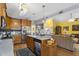 Kitchen island with dishwasher, sink, and access to the living room at 229 Hocutt Farm Dr Dr, Clayton, NC 27527