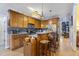 Functional kitchen with wood cabinetry, stainless steel appliances, and a breakfast bar at 229 Hocutt Farm Dr Dr, Clayton, NC 27527