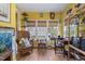 Bright sitting area with large windows, a writing desk, and a comfortable chair at 229 Hocutt Farm Dr Dr, Clayton, NC 27527