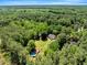 A lush, private home is secluded amongst the trees with a charming backyard pool and plenty of greenery at 25 Misty Way, Franklinton, NC 27525